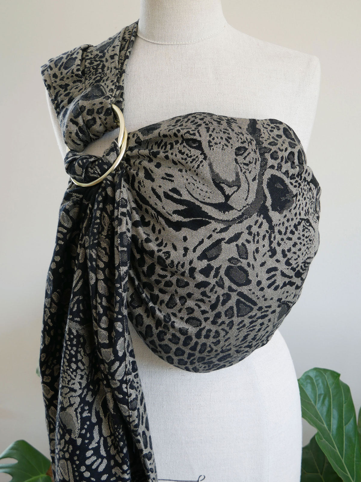 Leopard print Prowl Savannah Ring Sling on a mannequin with a white background