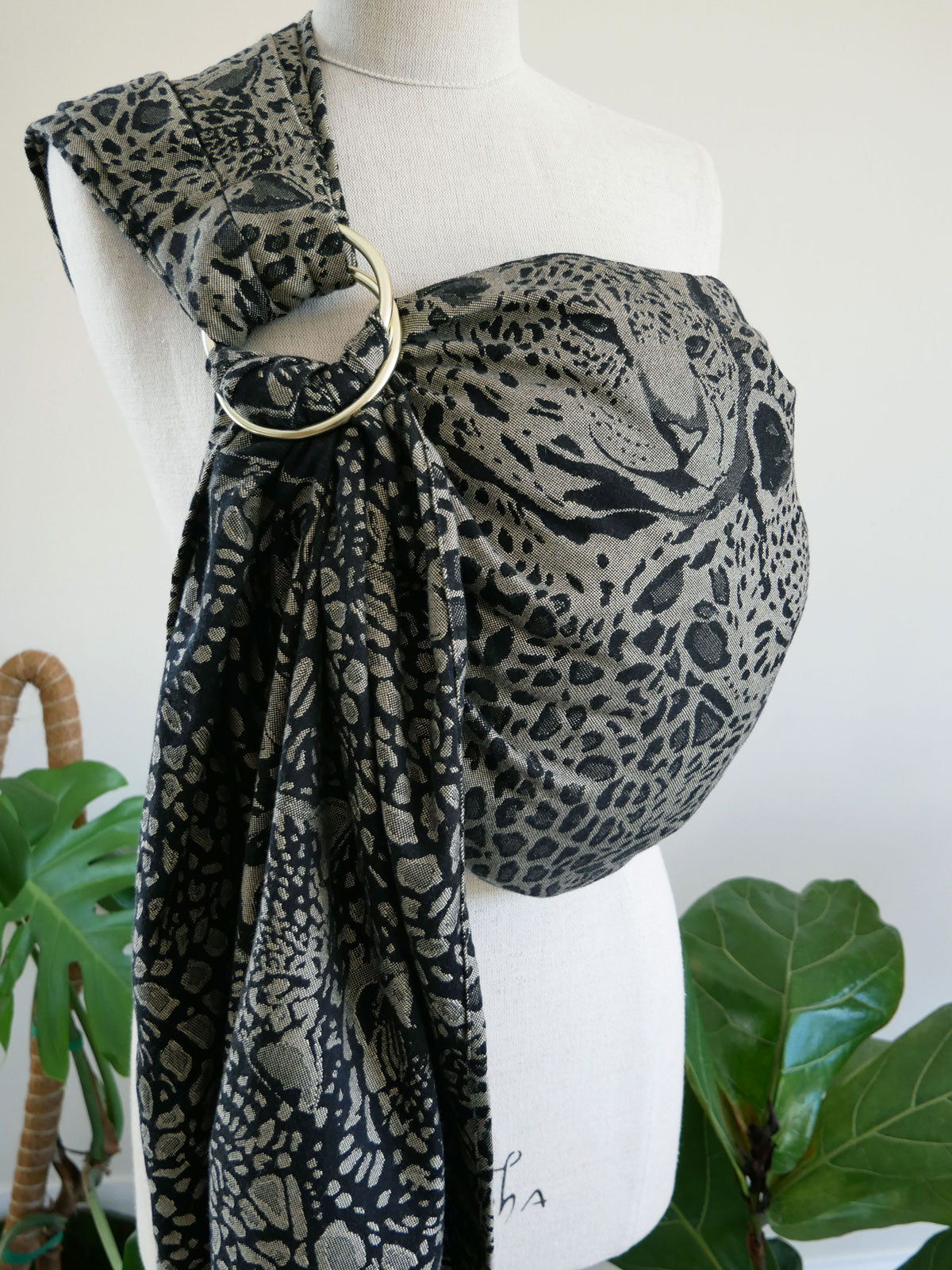 Leopard print Prowl Savannah Ring Sling on a mannequin with a white background