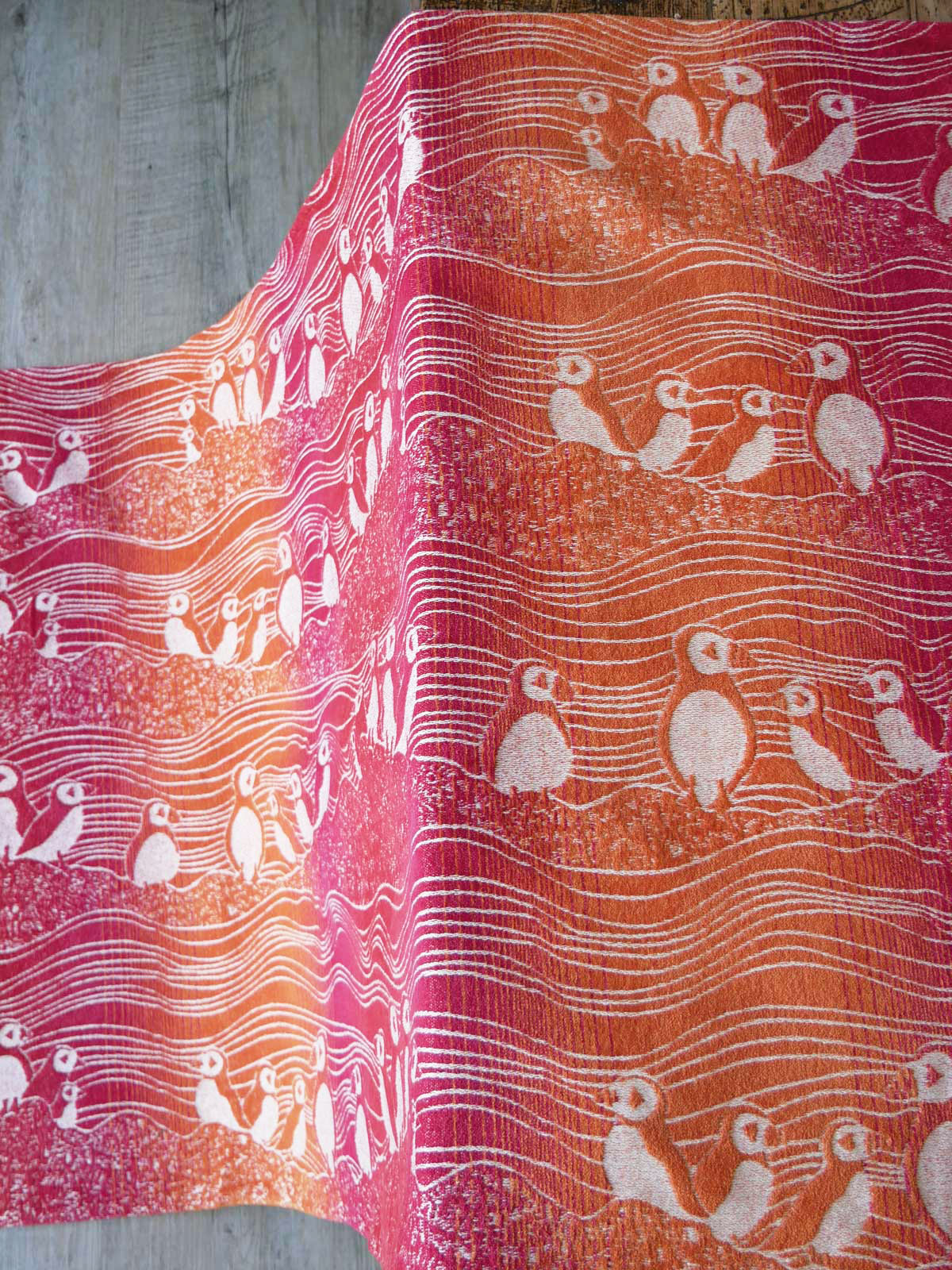 Draped puffins baby wrap fabric.