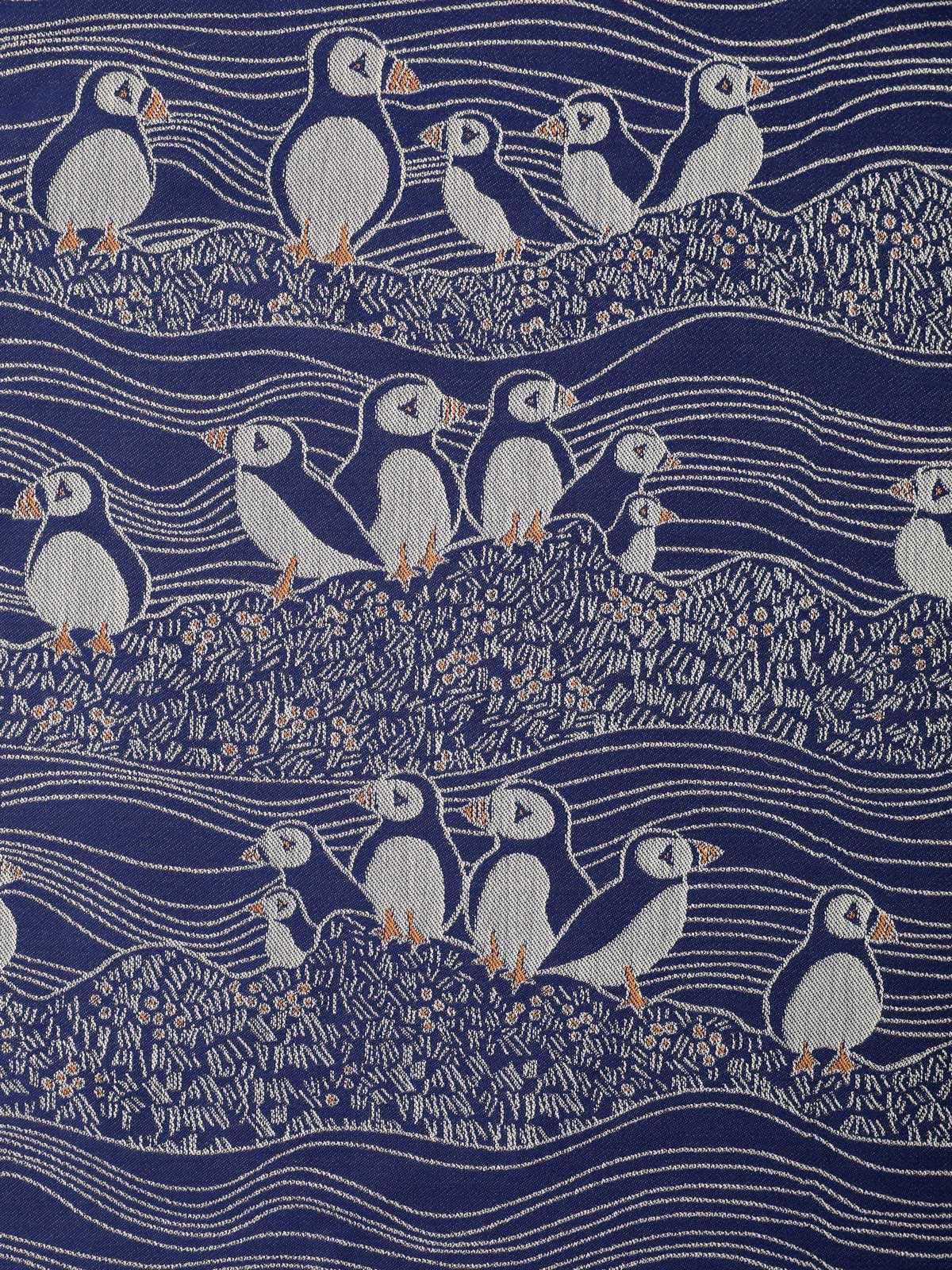blue and white puffins design fabric close up