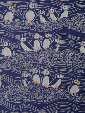 blue and white puffins design fabric close up